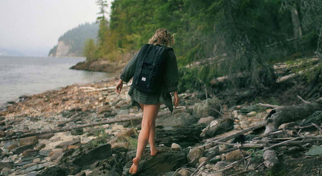 a-woman-hiking-and-woods